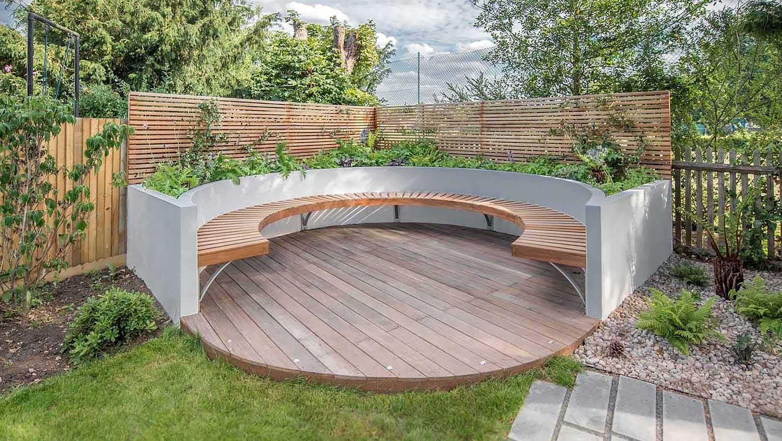Image of Round timber garden bed with bench seat